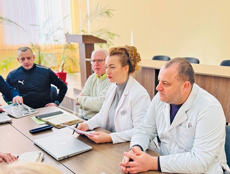 Aerial view of a desert area with a herd of cattle crossing a road