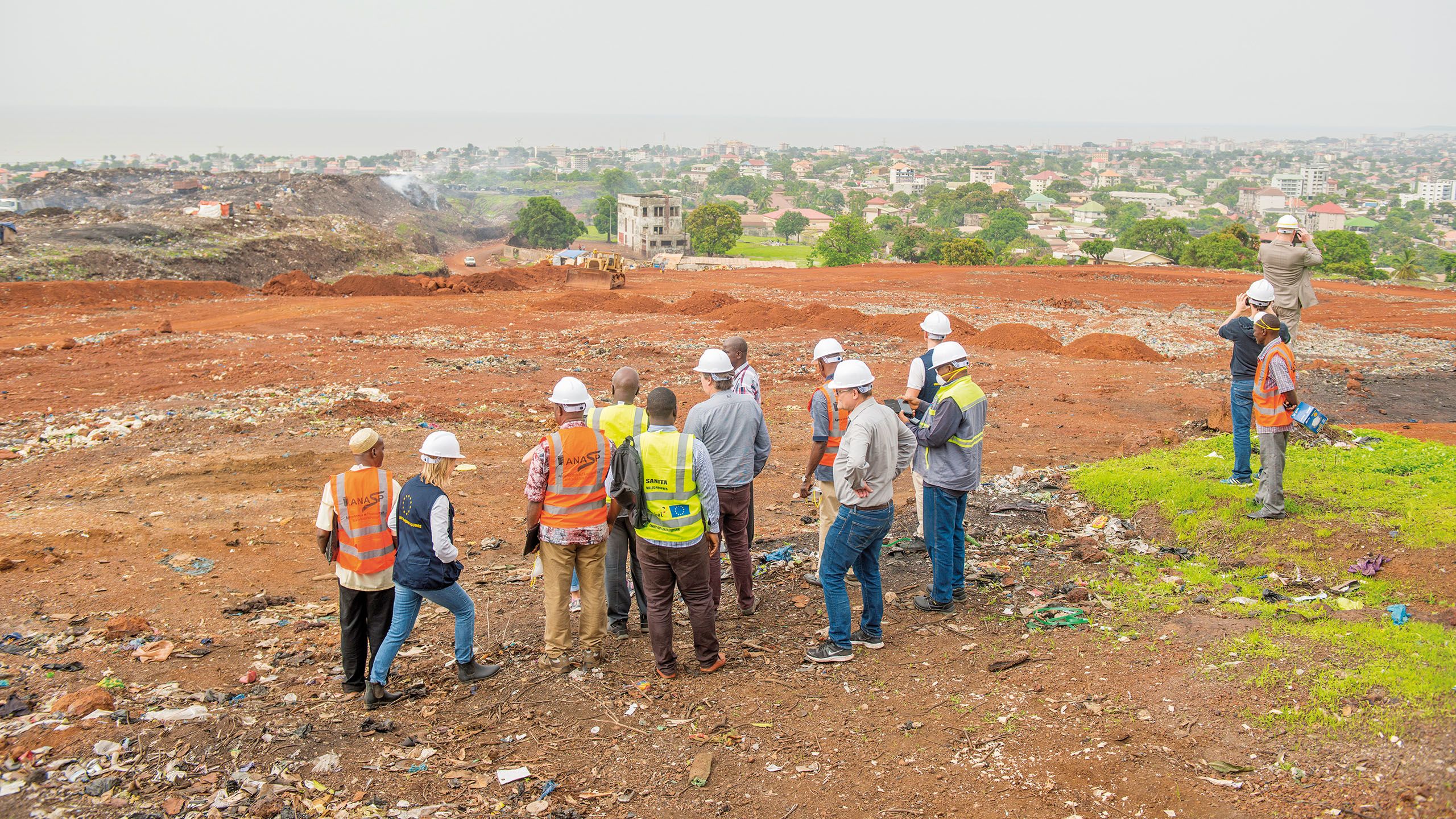 Group of people standing in front of a construction site