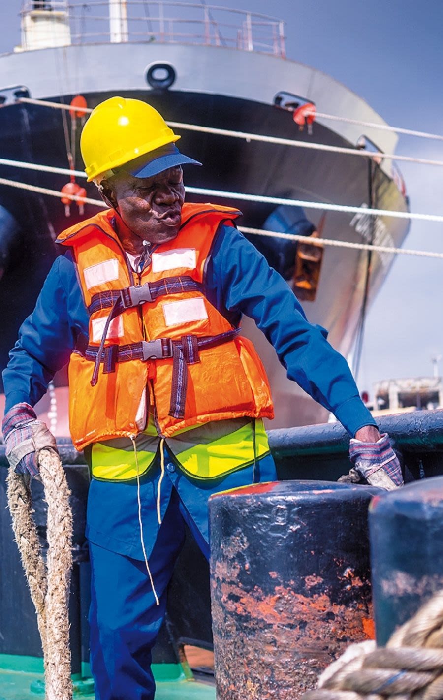 Harbour worker holding a rope