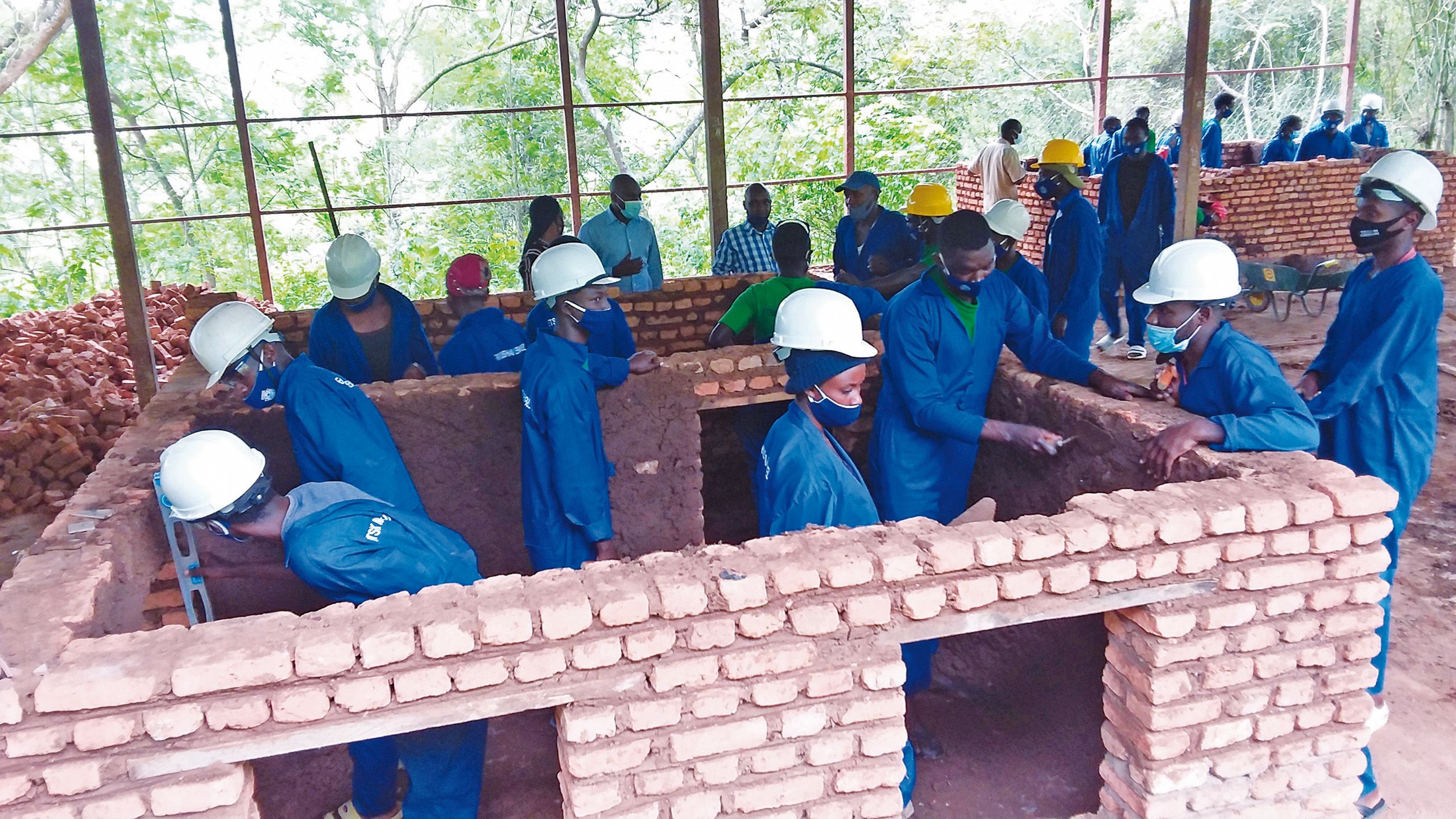 Young Rwandan workers constructing an infrastructure