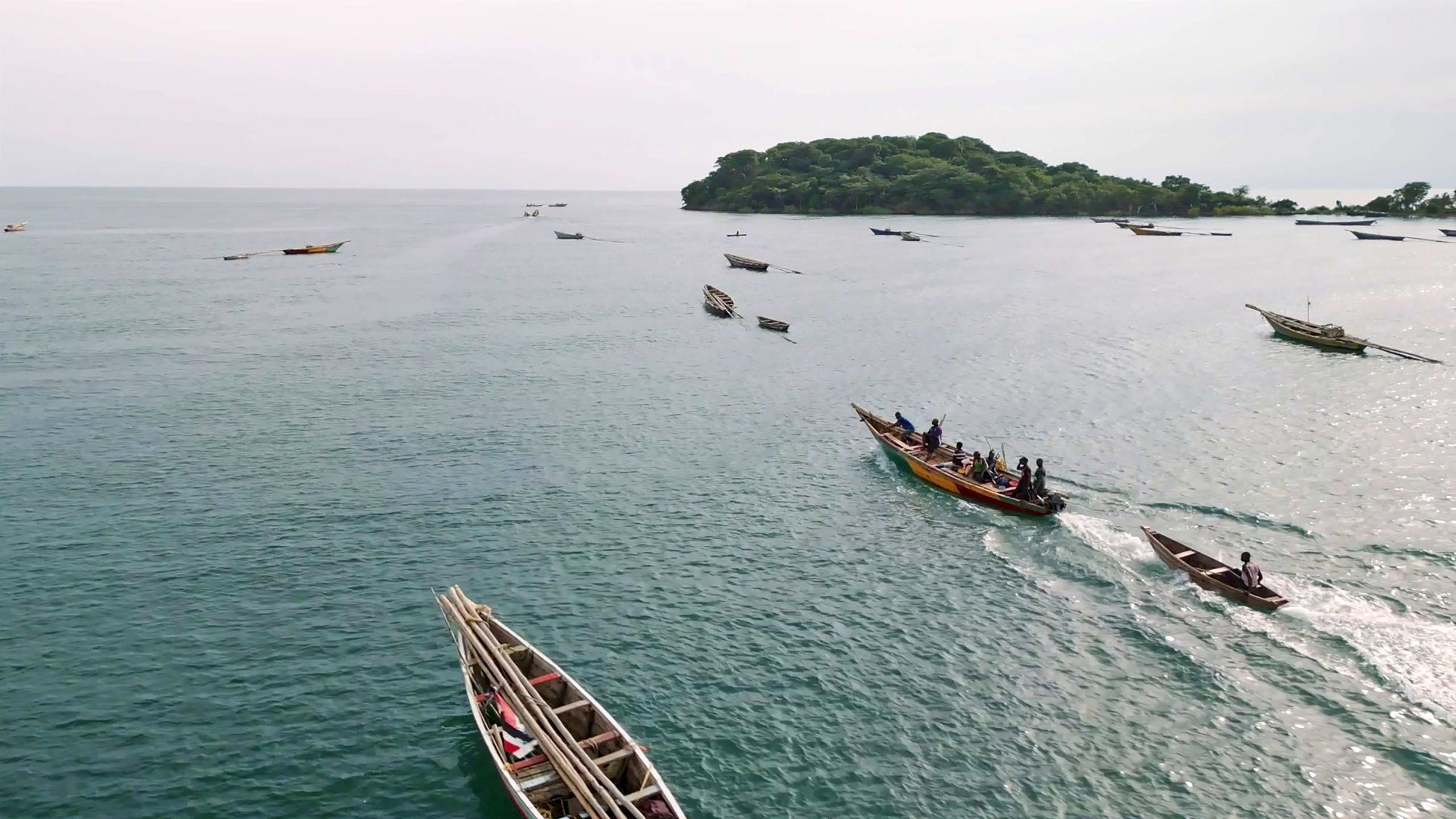 View of Lake Tanganyika with pirogues and people
