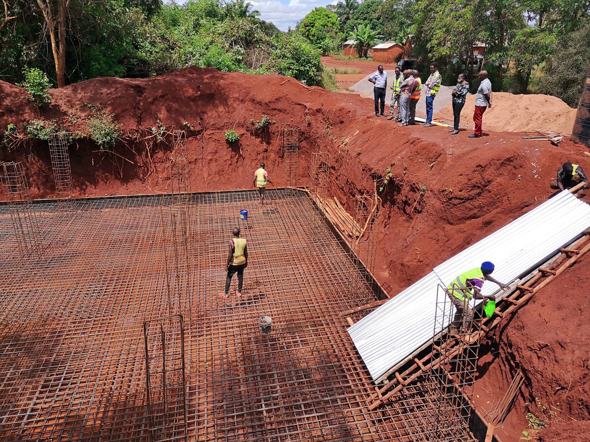 Construction site in Tanzania with workers at work